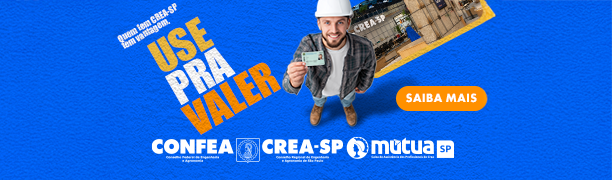 Businesswoman using a tablet, sitting in the living room