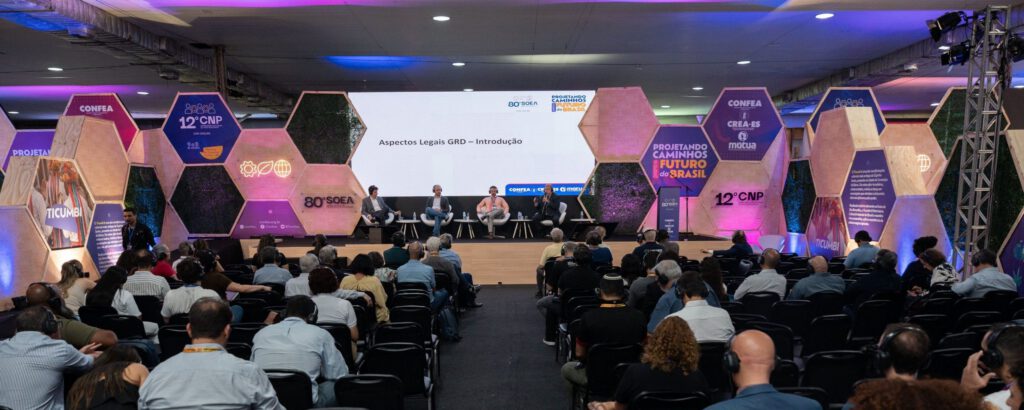 volunteers wearing raincoats taking donations to families affected by floods in southern Brazil