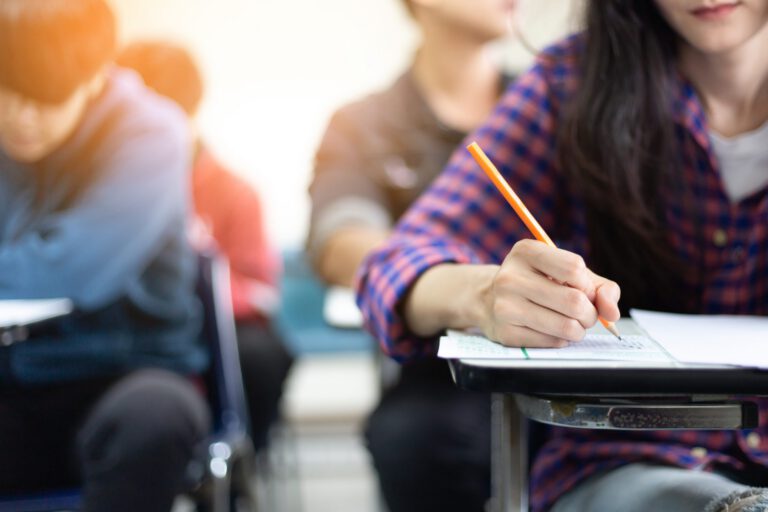 High,School,university,Student,Study.hands,Holding,Pencil,Writing,Paper,Answer,Sheet