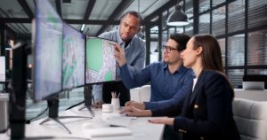 Team Of Diverse Professionals Using GIS