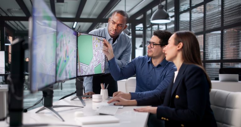 Team Of Diverse Professionals Using GIS